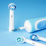 Modern Electric Toothbrush And Spare Heads On Blue 2022 12 16 12 47 15 Utc 1 1.jpg
